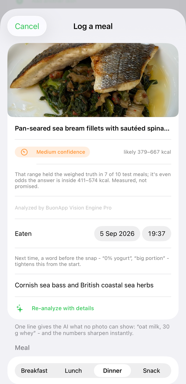 The full review with a menu line typed in - Cornish sea bass and British coastal sea herbs - above the Re-analyze with details button; a Medium confidence badge with likely 379–667 kcal, the footnote stating that range held the weighed truth in 7 of 10 test meals with even odds inside 411–574, and the Eaten date row